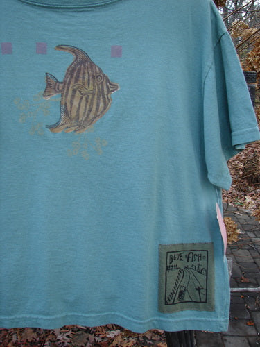 1994 NWT Short Sleeved Tee Fish Bowl Seagrass Size 3, featuring a fish drawing, ribbed neckline, slight bottom flair, and Blue Fish Poetry Patch, from the Spring Collection of 1994.