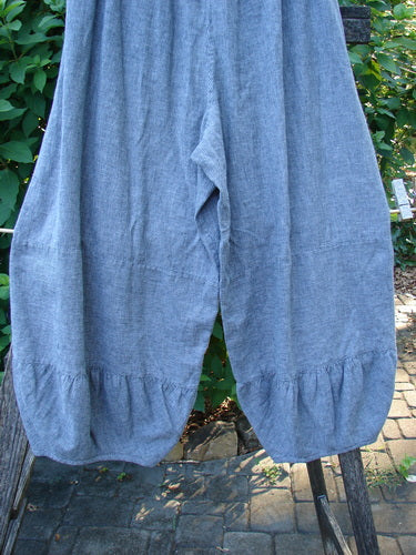 Barclay Hemp Cotton Meadow Pant, Indigo Stripe, Size 1, hanging on a clothesline. Features include full elastic waist, bellowing mid-sections, gathered panels, and slightly cropped length. Perfect for spring or summer.