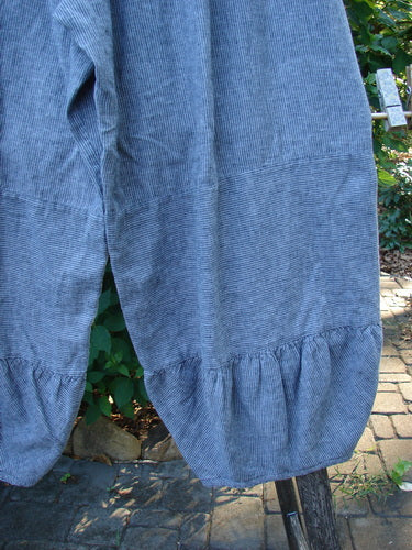 Barclay Hemp Cotton Meadow Pant Unpainted Indigo Stripe Size 1, featuring a full elastic waistline and bellowing mid and lower sections, hanging on a clothesline against a natural outdoor backdrop.