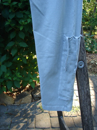 Barclay Cotton Lycra Side Gather Legging Unpainted Grey Grass Size 1, featuring a close-up of the leggings' side gather detailing with drawcords, emphasizing its soft texture and elegant, tapering design.