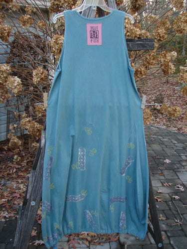 1993 Journey Jumper Vase and Heart Ocean Size 1: A blue dress with lower vertical arches, a belled shape, and a deep scoop neckline. Features a painted neckline with a vase and curly heart theme. Made from mid-weight cotton.