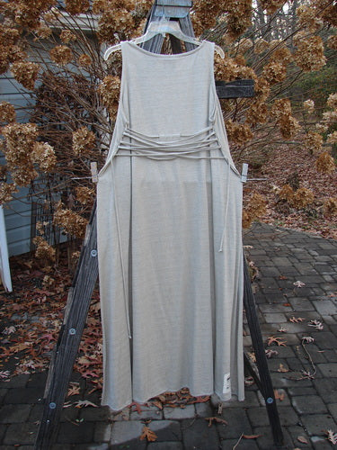 1998 Linen Knit Wrap Dress Unpainted Natural Size 2: Flowing dress on clothes rack, perfect condition. Rounded neckline, slender silhouette, elegant drape.