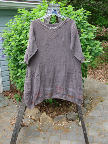 Barclay Linen Crossover Urchin Dress Feather Border Pebble Size 0 features a V-neckline, drop shoulders, empire waist, asymmetric hem, flutter lining, and double side pockets, embodying Blue Fish Clothing's vintage charm.