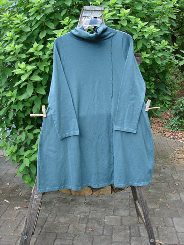 Barclay NWT Eco Cotton Cowl Pocket Tunic Star Moon Hypnea Teal Size 0 displayed on a swinger, showcasing its elegant drape and distinct cowl pocket design, embodying Bluefishfinder.com's vintage charm.
