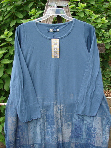 Barclay NWT Natalia Round Bottom Tunic City Floral Echo Blue Size 0 on a clothes line, showcasing its casual elegance and unique design, reflecting Bluefishfinder.com's vintage style.