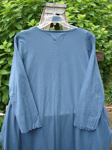 Barclay NWT Natalia Round Bottom Tunic City Floral Echo Blue Size 0 displayed on a hanger, showcasing its unique cloak-like sleeves and round bottom design, reflecting Bluefishfinder.com's vintage-inspired, creatively expressive style.