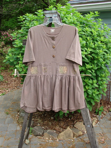 1999 Garden Herb Dress Riverbed Floral Altered Size 1, featuring a slimmer lower flounce, four-paneled pocket, drop waistline, ceramic top button, and flirty hemline, showcasing Bluefishfinder's vintage style and individuality.