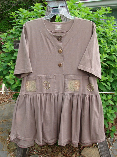 1999 Garden Herb Dress Riverbed Floral Altered Size 1 features a drop waistline with a four-paneled pocket, slimmer flounce, and flirty hemline, embodying Blue Fish's creative vintage style.