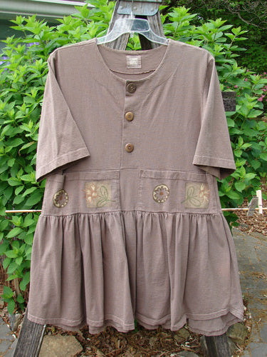 1999 Garden Herb Dress Riverbed Floral Altered Size 1 features a drop waistline with a four-paneled pocket, slimmer flounce, and flirty hemline, embodying Blue Fish's creative vintage style.