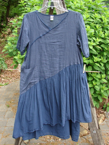 Barclay Cross Over Two Tier Angle Dress showcases a layered prairie style with a sweet laced hemline and oversized side pocket, embodying vintage romanticism and summer grace.