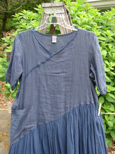 Barclay Cross Over Two Tier Angle Dress in unpainted navy, showcases a layered, prairie-inspired design with a sweet laced hemline and oversized side drop pocket, embodying romantic summer charm.