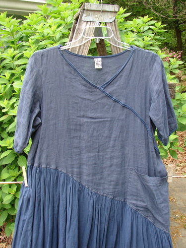 Barclay Cross Over Two Tier Angle Dress in unpainted navy, showcases a layered, prairie-inspired design with a sweet laced hemline and oversized side drop pocket, embodying romantic summer charm.