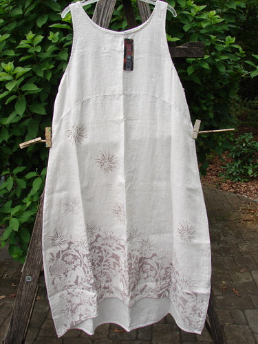 Barclay NWT Linen Sundress Spin Floral Garden Natural Fog Size 0 features intricate patterns, showcased against a backdrop of green leaves, reflecting Bluefishfinder.com's commitment to vintage-inspired, expressive fashion.