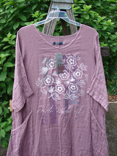 Barclay NWT Linen Wave Urchin Dress Circle Garden Tulsi Rose Size 0 displayed on a hanger, showcasing intricate floral patterns, reflecting vintage Blue Fish Clothing's ethos of creative individuality and timeless design.