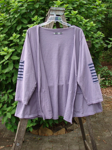 Barclay Sample Open Front Stripe Patch Jacket Rear Celestial Lavender OSFA displayed on an outdoor wooden swing structure, emphasizing its unique design and vintage charm, aligning with Bluefishfinder.com's creative and expressive ethos.