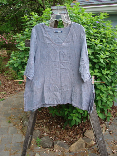 Barclay Contrast Stitch Springtime Top in mottled grey lilac, featuring curvy S seams, pinched sleeves, and a flowy A-line shape, ideal for expressing individuality. Size 0, medium-weight organic cotton.