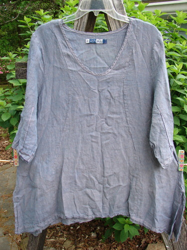 Barclay Contrast Stitch Springtime Top in Mottled Grey Lilac, featuring curvy seams, pinched sleeves, and an oval neckline, embodies vintage charm with its flowy A-line shape and intricate stitchery.