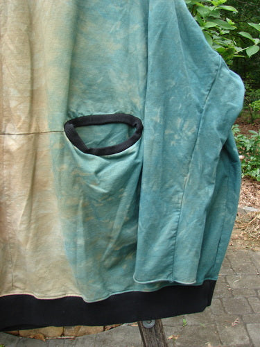 Barclay Cotton Lycra Open Rib Pocket Pullover in Mottled Forest Sunset OSFA, showcasing a close-up of a detailed pocket and black band on textured fabric, epitomizing vintage Blue Fish Clothing's creative freedom.