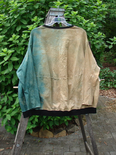 Barclay Cotton Lycra Open Rib Pocket Pullover Mottled Forest Sunset OSFA displayed on a swinger, highlighting its unique open rib design and pocket detail, epitomizing BlueFishFinder.com's vintage, expressive style.