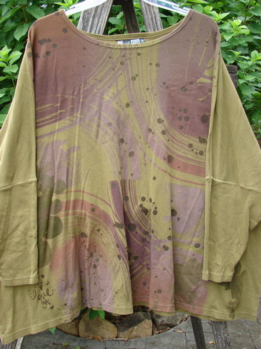 Barclay Dolman Sleeved Pullover Top Wind & Rain Peapod OSFA displayed on a clothes rack, showcasing its unique pattern and long sleeves, embodying Bluefishfinder.com's vintage, creative, and individualistic fashion style.