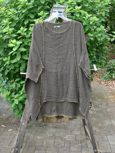 Barclay Gauze Linen Exterior Curve Hi Low Pullover Unpainted Stick OSFA displayed on an outdoor clothes rack, showcasing its elegant drape and unique silhouette, embodying Bluefishfinder.com's vintage aesthetic.