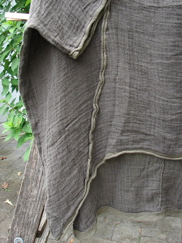 Barclay Gauze Linen Exterior Curve Hi Low Pullover OSFA displayed close-up, showcasing its textured fabric and unique silhouette, embodying Bluefishfinder.com's commitment to vintage-inspired, expressive clothing for diverse women.