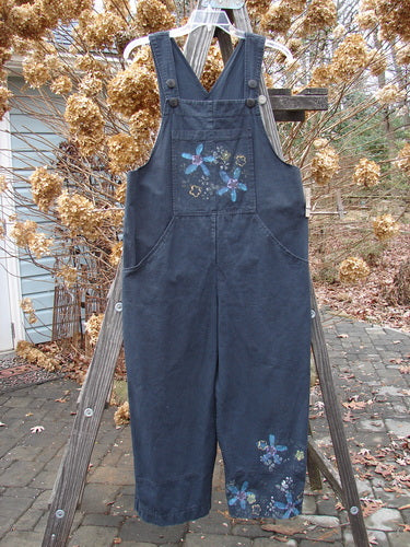 2000 Parachute Overall Jumper Floral Black Size 0: Lightweight cotton overall with oversized painted front bib pocket, deep side pockets, adjustable shoulder straps, metal button side adjustments, wide swingy lowers, drawcord back, and signature patch. Bust 13, Waist 42, Hips 52, Inseam 25, Length 50-57.