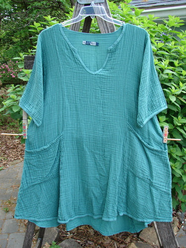 Barclay Gauze Key Pocket Everyday Dress in Unpainted Spearmint Stripe, featuring a keyhole neckline, A-line shape, three-quarter sleeves, triangular drop pockets, and a drawcord back for versatile styling.