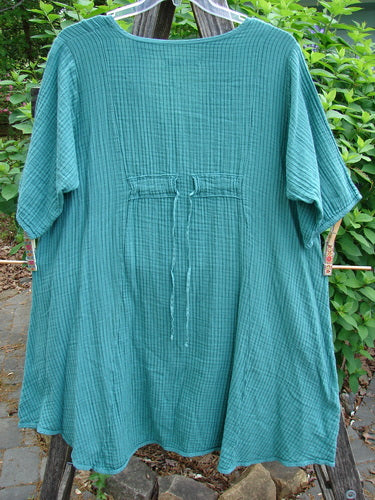 Barclay Gauze Key Pocket Everyday Dress in Spearmint Stripe, featuring a keyhole neckline, A-line shape, three-quarter sleeves, triangular drop pockets, and a back drawcord, capturing BlueFishFinder's vintage charm.