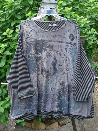 Barclay Modernist High Low Top Fantastic Dream Black Grey Stripe OSFA showcases a unique high-low hem, detailed fabric pattern, and a relaxed fit, reflecting Bluefishfinder.com's commitment to creative, vintage-inspired fashion.