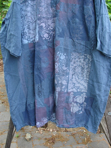 Barclay Linen Oversized Gallery Dress Victorian Echo OSFA features a rounded neckline, drop shoulders, and three-quarter dolman sleeves. Its wide, straight design is pocketless, showcasing a Victorian theme paint.