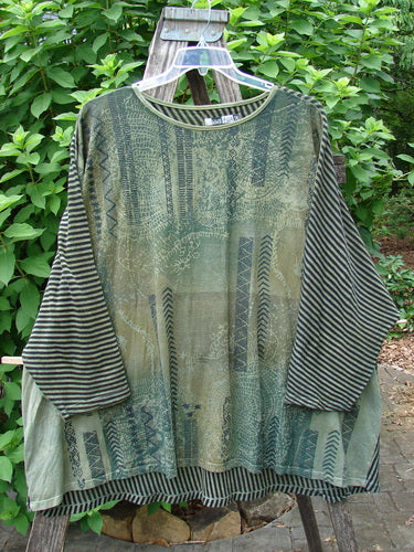 Barclay Modernist High Low Top Continuous Path Black Green Stripe OSFA draped on a rack, highlighting its unique high-low hem design and bold stripes, embodying BlueFishFinder's vintage and expressive fashion style.