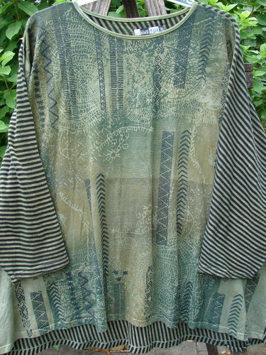 Barclay Modernist High Low Top Continuous Path Black Green Stripe OSFA features a striking pattern with long sleeves, showcased on a rack. Designed for comfort and style, it embodies vintage Blue Fish Clothing's creative spirit.