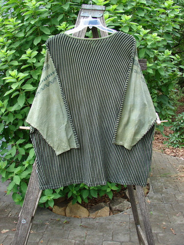 Barclay Modernist High Low Top Continuous Path Black Green Stripe OSFA displayed on a clothes rack, highlighting its unique high-low hem design.