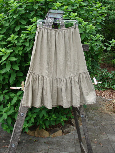 Barclay NWT Batiste Mid Layer Gather Ruffle Skirt Unpainted Dovetail Size 0 displayed draped over a wooden ladder, highlighting its delicate ruffled design, suitable for vintage-inspired creative expression.