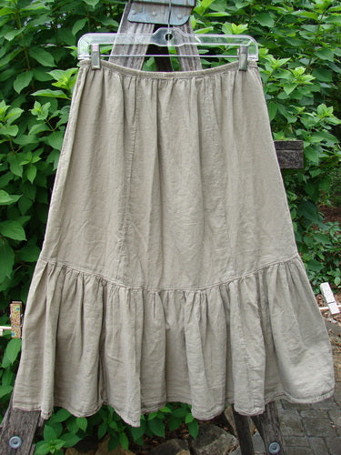 Barclay NWT Batiste Mid Layer Gather Ruffle Skirt Unpainted Dovetail Size 0 hanging on a clothesline, showcasing its intricate fashion design pattern and elegant textile, reflecting Bluefishfinder.com's vintage flair.