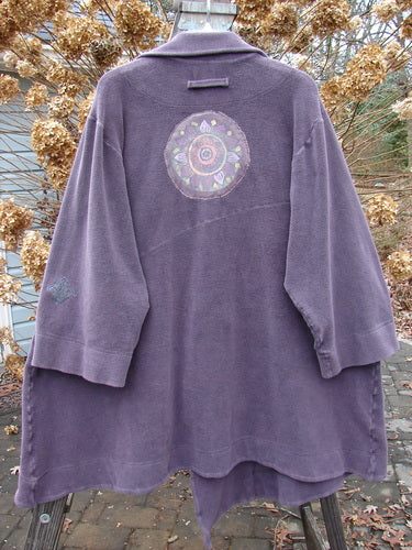 2000 PMU Celtic Moss Highlander Coat Aubergine Size 1: A purple coat with serious seams on the front and back. Features an empire waistline, multiple patches, and big collared front.