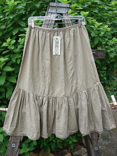 Barclay NWT Batiste Mid Layer Gather Ruffle Skirt Unpainted Dovetail Size 0 displayed on a swinger, showcasing its elegant ruffle details and soft, flowing fabric, embodying Bluefishfinder.com's vintage charm.