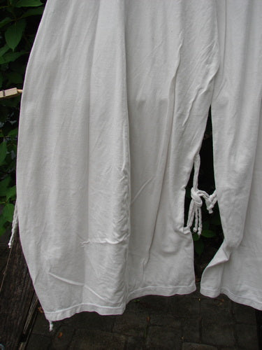 Barclay NWT Crop Billow Pant Unpainted Jasmine Dew Size 0, displayed outdoors, showcases its airy and flowing design, emphasizing comfort and creativity, ideal for expressing individuality through vintage-inspired fashion.