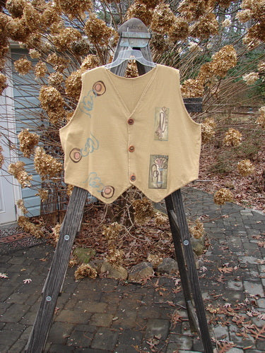 1995 Cottage Vest with musical theme design on a wooden stand.