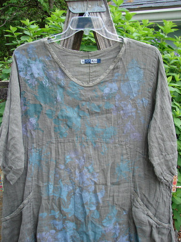 Barclay Linen Two Pocket Urchin Dress in Grey Moss features a rounded neckline, A-line flair, empire waist seam, and mixed garden theme paint, offering a unique vintage style from Bluefishfinder.com.