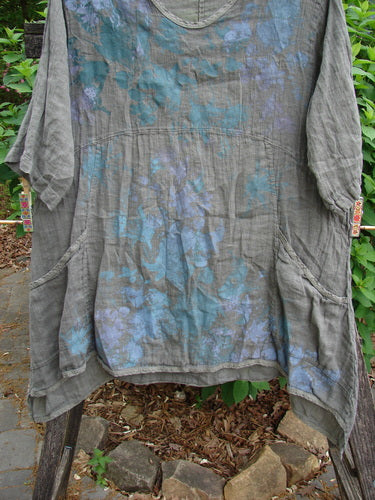 Barclay Linen Two Pocket Urchin Dress Mixed Garden Grey Moss Size 0 features a rounded neckline, empire waist, A-line flair, and exterior drop pockets, embodying vintage Blue Fish Clothing style.