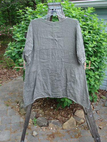 Barclay Linen Two Pocket Urchin Dress Mixed Garden Grey Moss Size 0, showcasing a rounded neckline, empire waist, A-line flair, varying hem, and exterior drop pockets, embodying BlueFishFinder's vintage, expressive style.