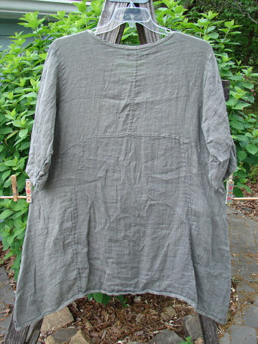 Barclay Linen Two Pocket Urchin Dress Mixed Garden Grey Moss Size 0, featuring a rounded neckline, empire waist seam, swaying hemline, wider sleeves, A-line flair, exterior drop front pockets, and garden-themed design.