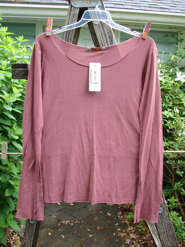 Barclay NWT Modal Batiste Layer Top in Desert Rust, featuring long narrowing sleeves, rounded neckline, and raw edges, embodies Bluefishfinder.com's vintage elegance and creative expression ethos.