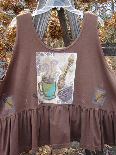 1992 Peplum Top Steaming Soup Mushroom OSFA with a teacup and spoon graphic, featuring a downward yoked waist seam, rounded neckline, high arm openings, and a gathered bottom flounce.