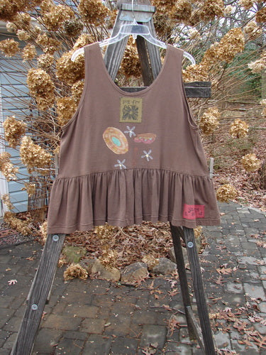 1992 Peplum Top Magic Chair Mushroom OSFA: A brown tank top with a design on it. Baby doll style with a wide waist and gathered bottom flounce.