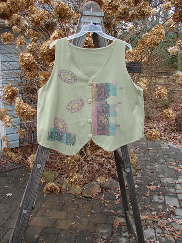 1989 Folk Vest Fish Flower Star Sage OSFA displayed on a mannequin, showcasing front tuxedo tails, upward scooped back, and colorful vintage floral pattern with matching buttons and V-shaped neckline.