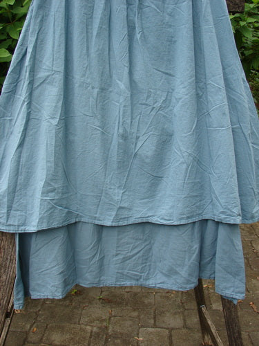 Barclay NWT Batiste Two Tier Layer Skirt Floral Cluster Sea Size 0 displayed on a stand, showcasing its intricate floral pattern and layered design, embodying BlueFishFinder's vintage charm and creative individuality.