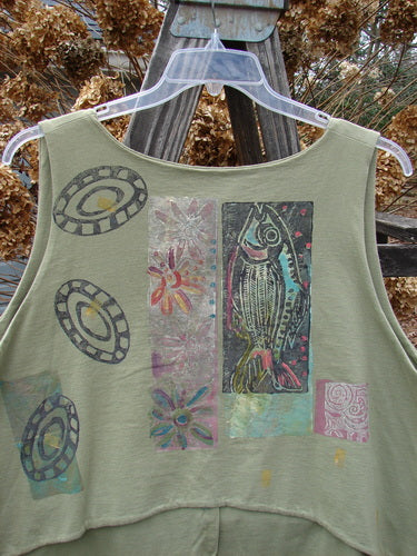 1989 Folk Vest Fish Flower Star Sage OSFA: A green tank top with fish and flower patterns, front tuxedo tails, upward scooped back line, V-shaped neckline, and fabulous matching buttons from Blue Fish's 1989 Summer Collection.